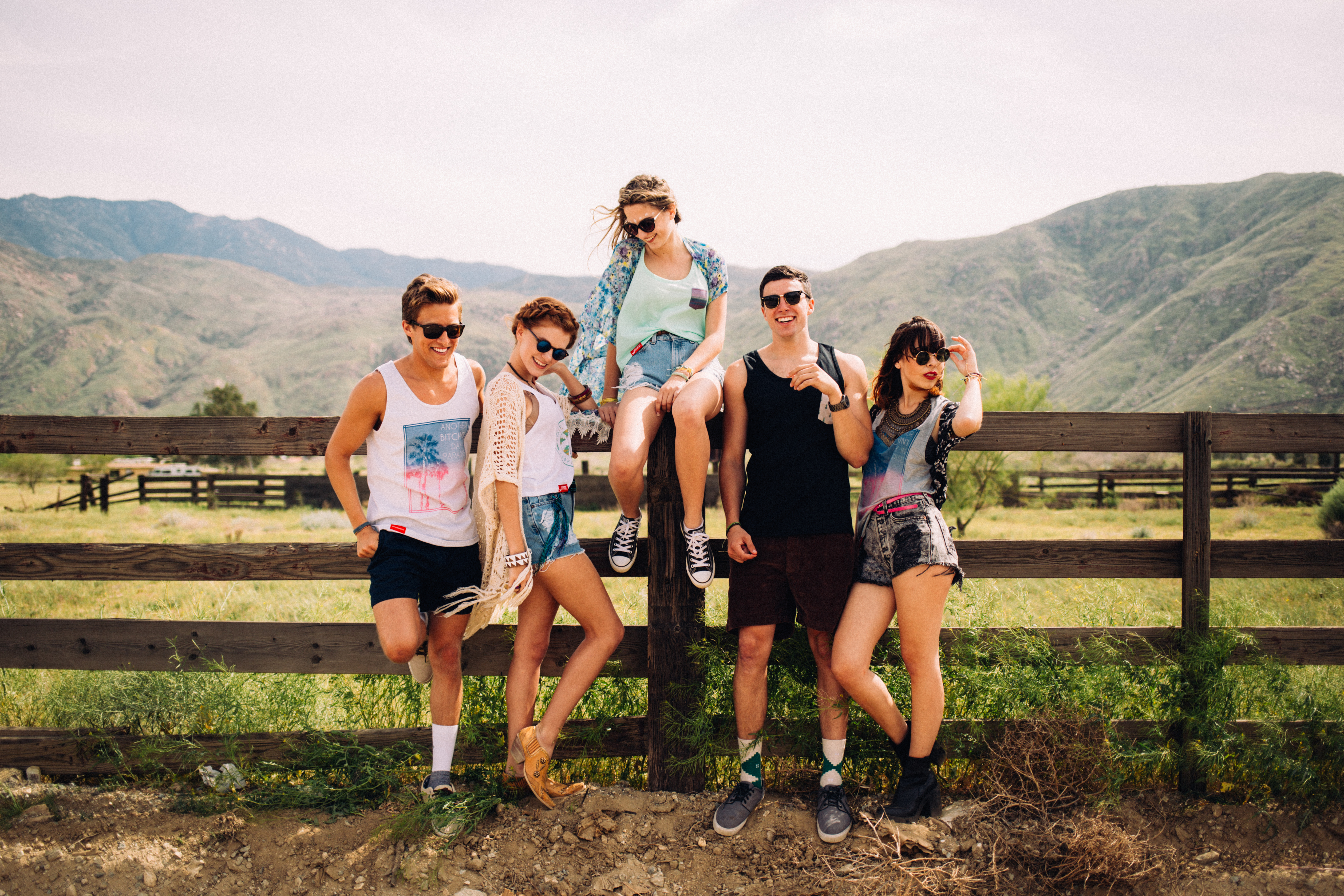 Young adults posing in State Collegewear clothing