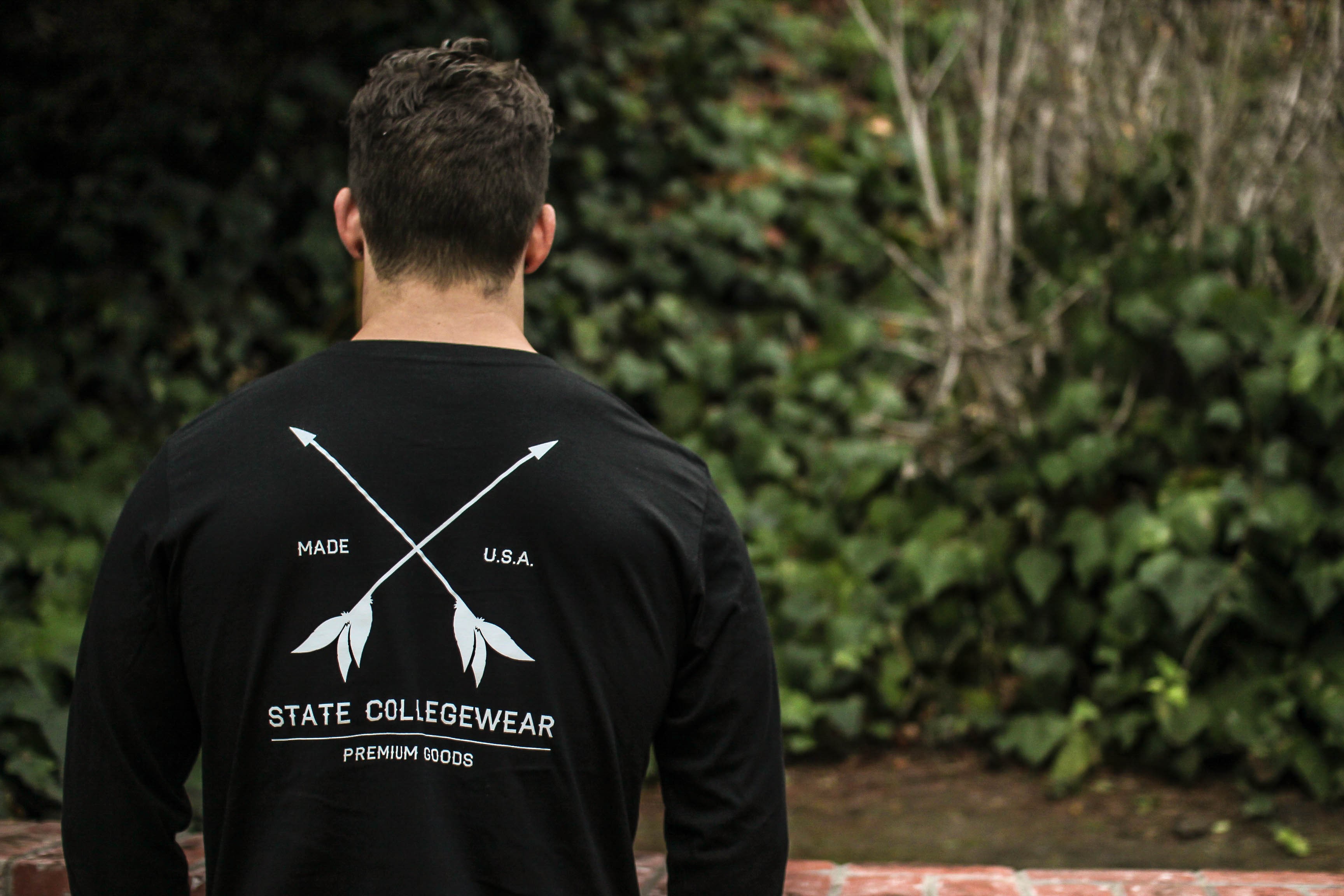 Young adult posing in State Collegewear clothing